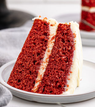 a slice of red velvet cake on a white plate