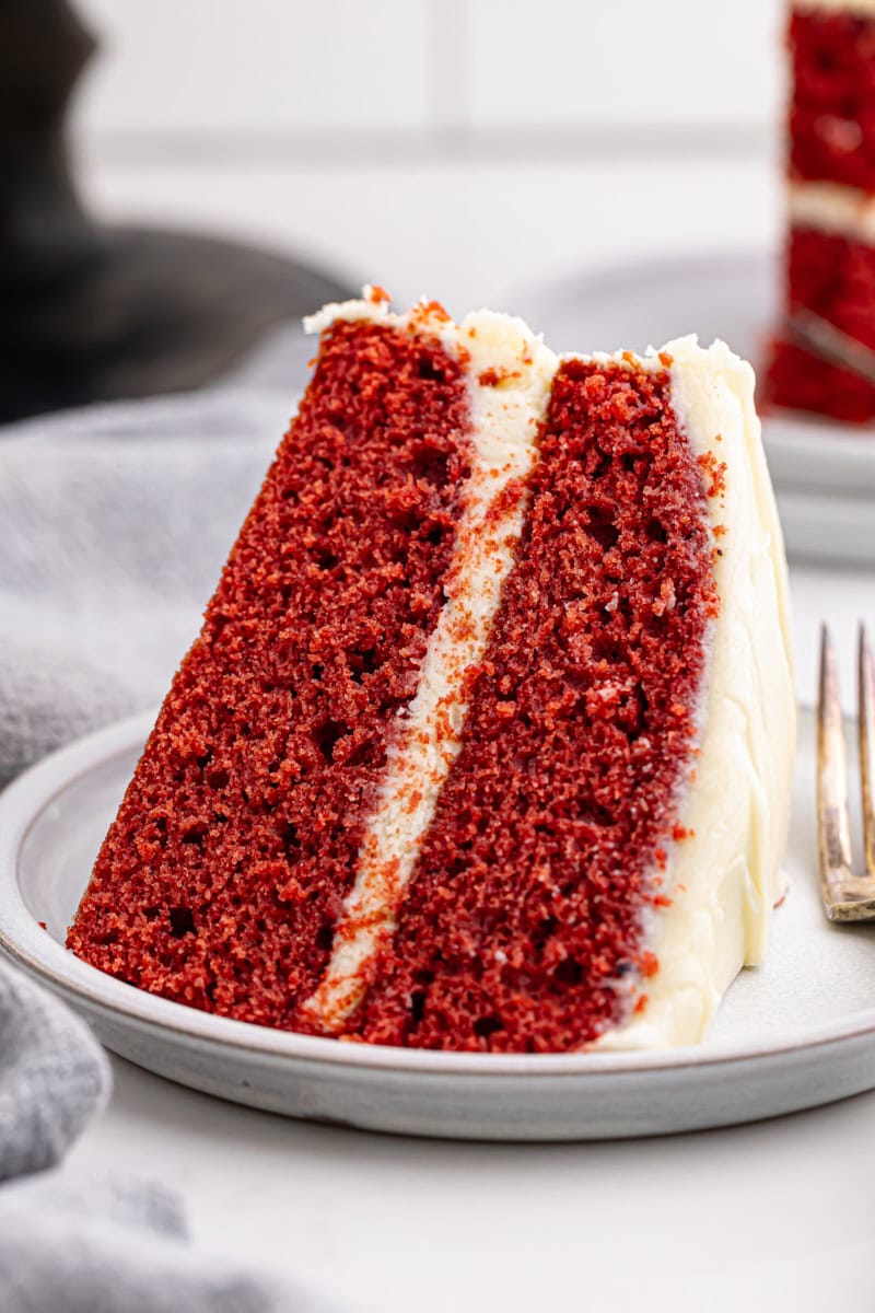 a slice of red velvet cake on a white plate