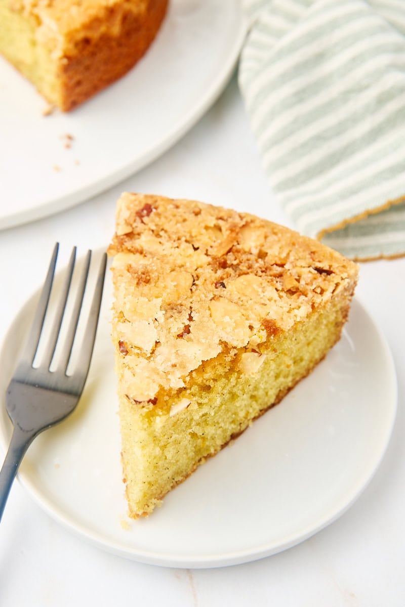 a slice of cardamom cake on a white plate