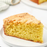 a slice of cardamom cake on a white plate