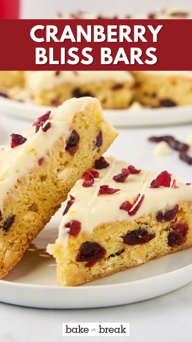 two cranberry bliss bars on a white plate; text overlay "cranberry bliss bars"