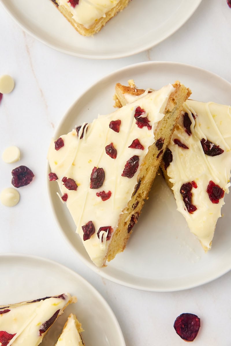 overhead view of two cranberry bliss bars on a white plate