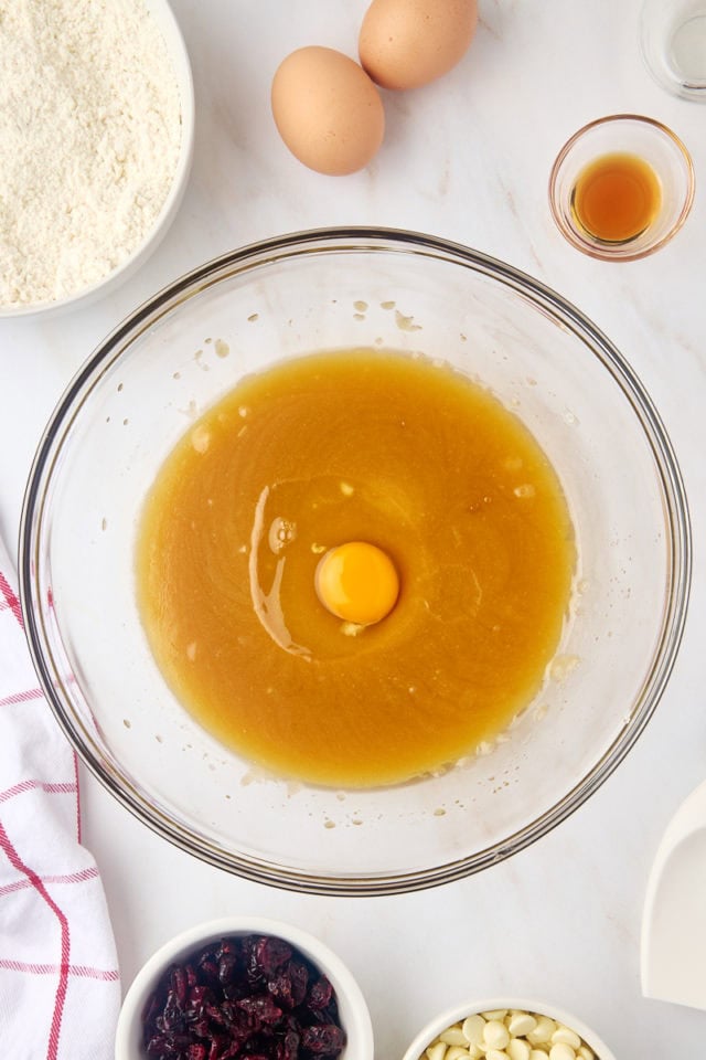 overhead view of egg added to butter/sugar mixture