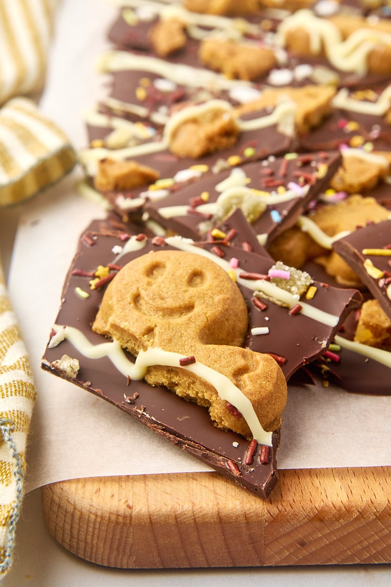 gingerbread bark on a parchment-covered wooden cutting board