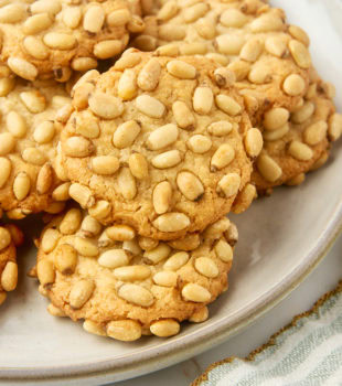 pignoli cookies on a plate