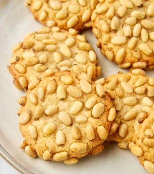 pignoli cookies on a plate