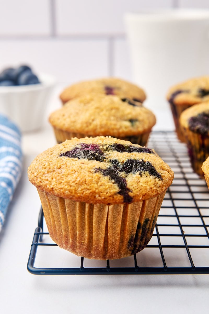 whole wheat blueberry muffins on a wire rack