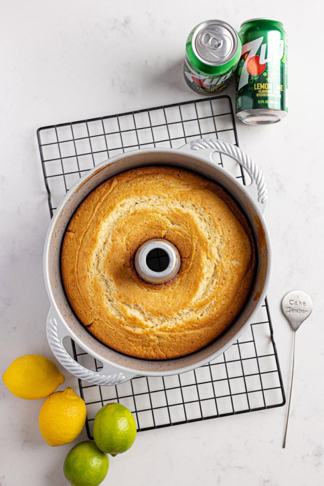 overhead view of freshly baked 7UP cake in a tube pan on a wire rack