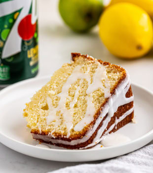 a slice of 7UP cake on a white plate