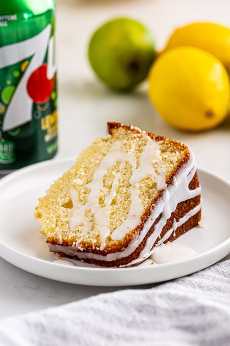 a slice of 7UP cake on a white plate