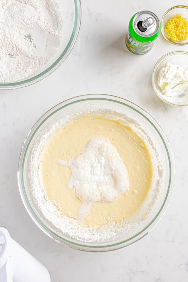 overhead view of sour cream added to cake batter