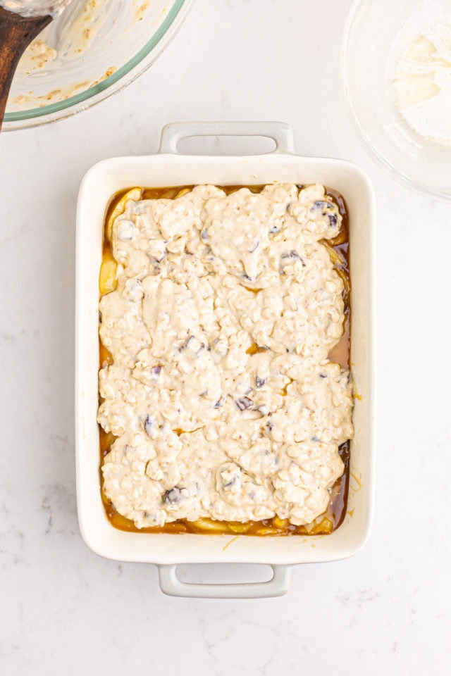 overhead view of unbaked caramel apple pear cobbler in a rectangular baking pan