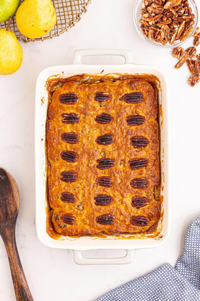 overhead view of freshly baked caramel apple pear cobbler in a rectangular baking pan