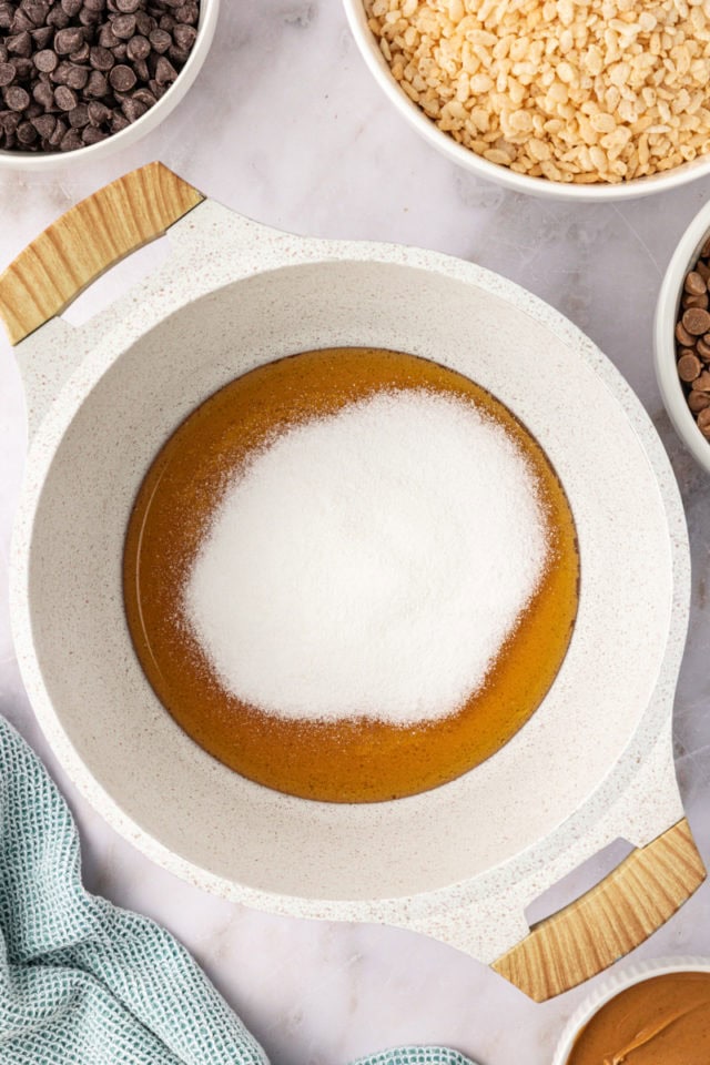 overhead view of honey and sugar in a saucepan