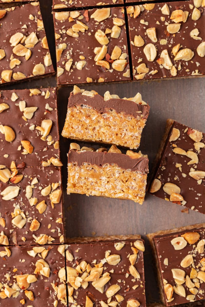 overhead view of chocolate peanut butter rice crispy treats, with some turned on their sides to show their layers