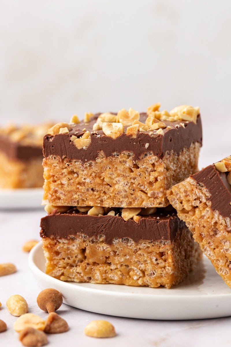 stack of two chocolate peanut butter rice crispy treats on a white plate