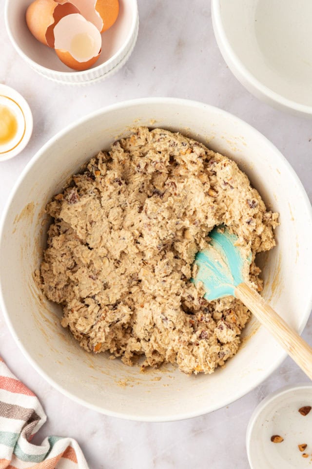 overhead view of oatmeal date cookie dough in a mixing bowl