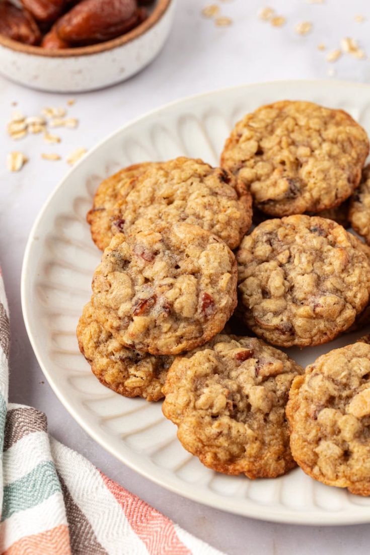 several oatmeal date cookies on a white plate