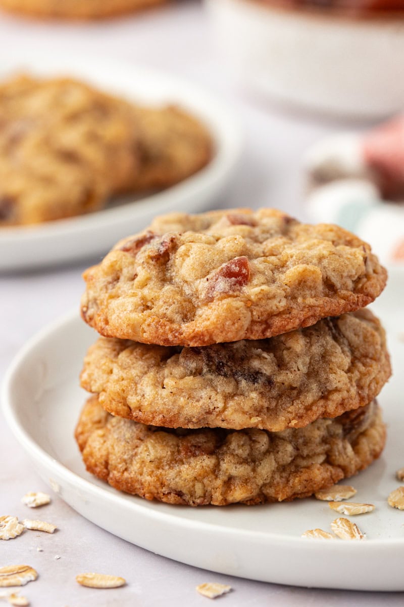 stack of three oatmeal date cookies on a white plate