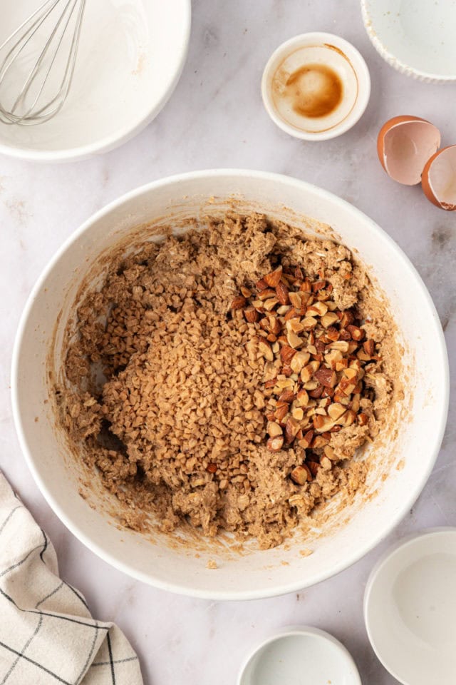 overhead view of almonds and toffee bits added to cookie dough