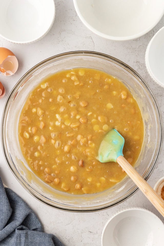 overhead view of white chocolate blondie batter in a glass mixing bowl