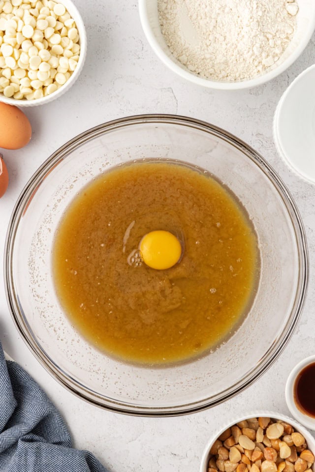 overhead view of egg added to butter-sugar mixture for white chocolate blondies