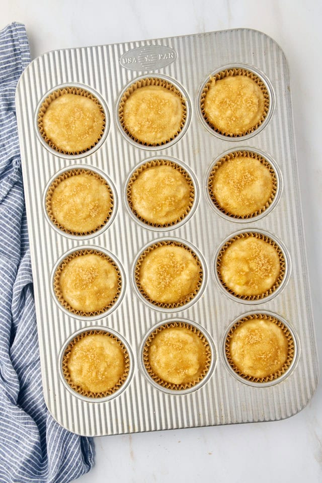 overhead view of portioned banana bread topped with coarse sugar