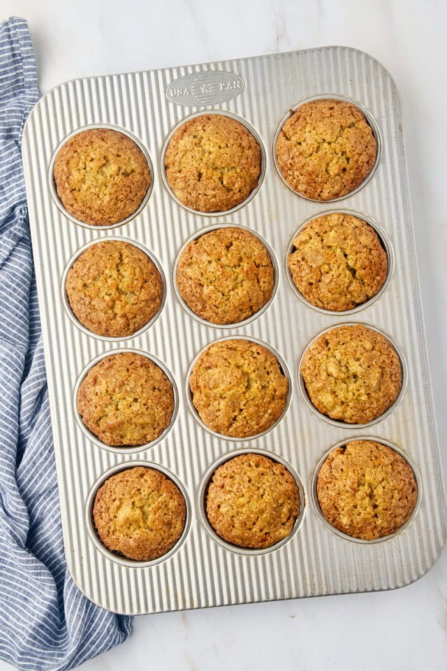 overhead view of freshly baked banana bread muffins in a muffin pan