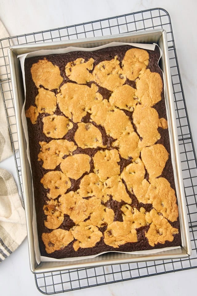 overhead view of freshly baked brookies in a 9x13 pan on a wire rack