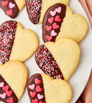 chocolate-dipped shortbread cookies on a white plate