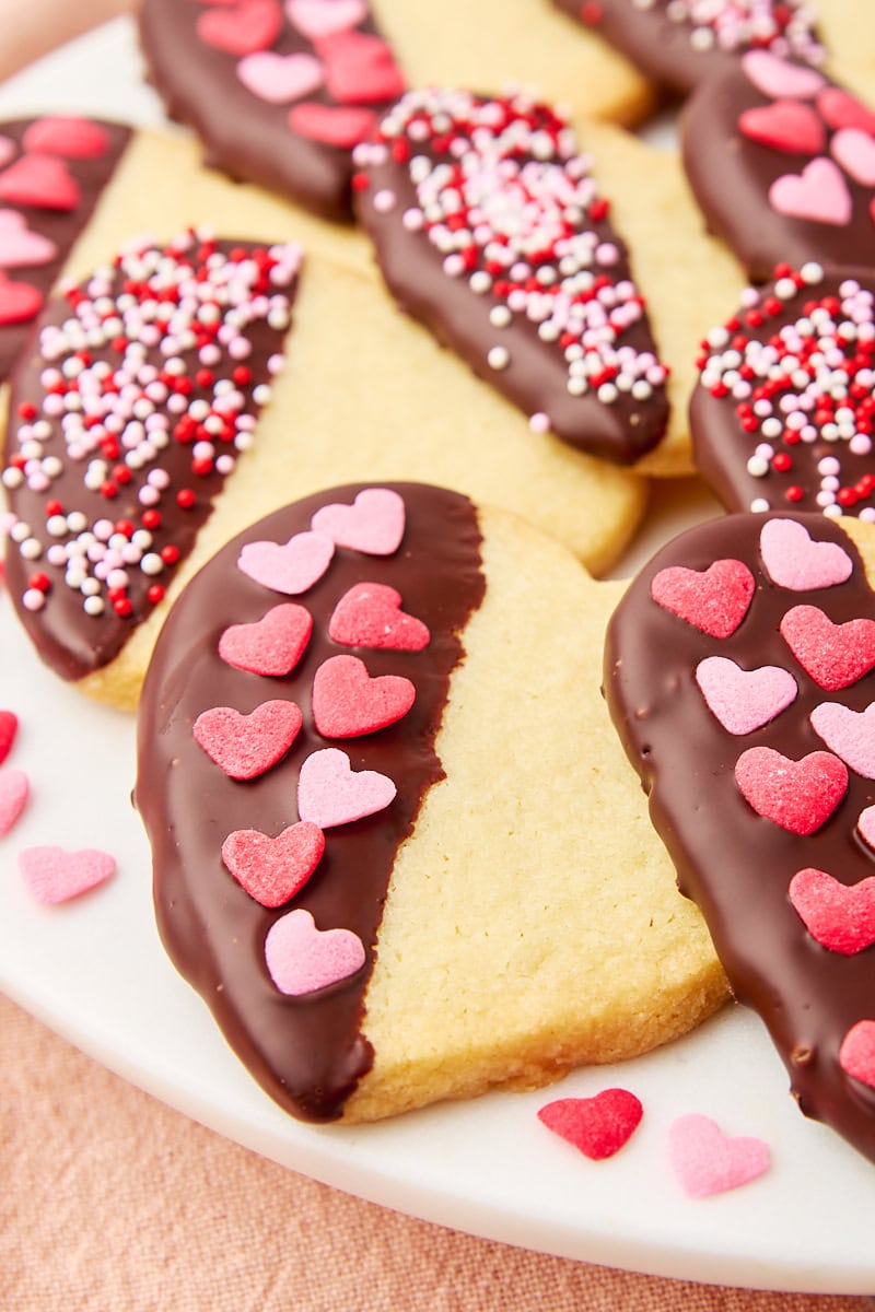 chocolate-dipped shortbread cookies on a white plate