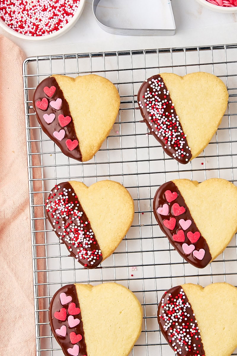 overhead view of chocolate-dipped shortbread cookies on a wire rack