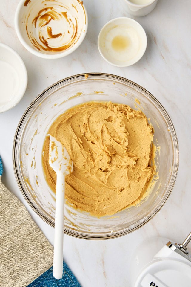 overhead view of cookie butter dip in a glass mixing bowl