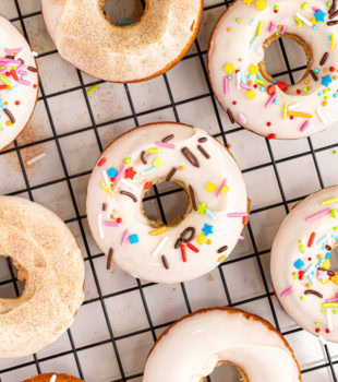 overhead view of baked doughnuts on a wire rack