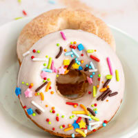 two baked doughnuts on a plate