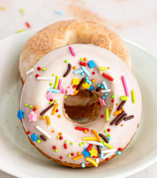 two baked doughnuts on a plate