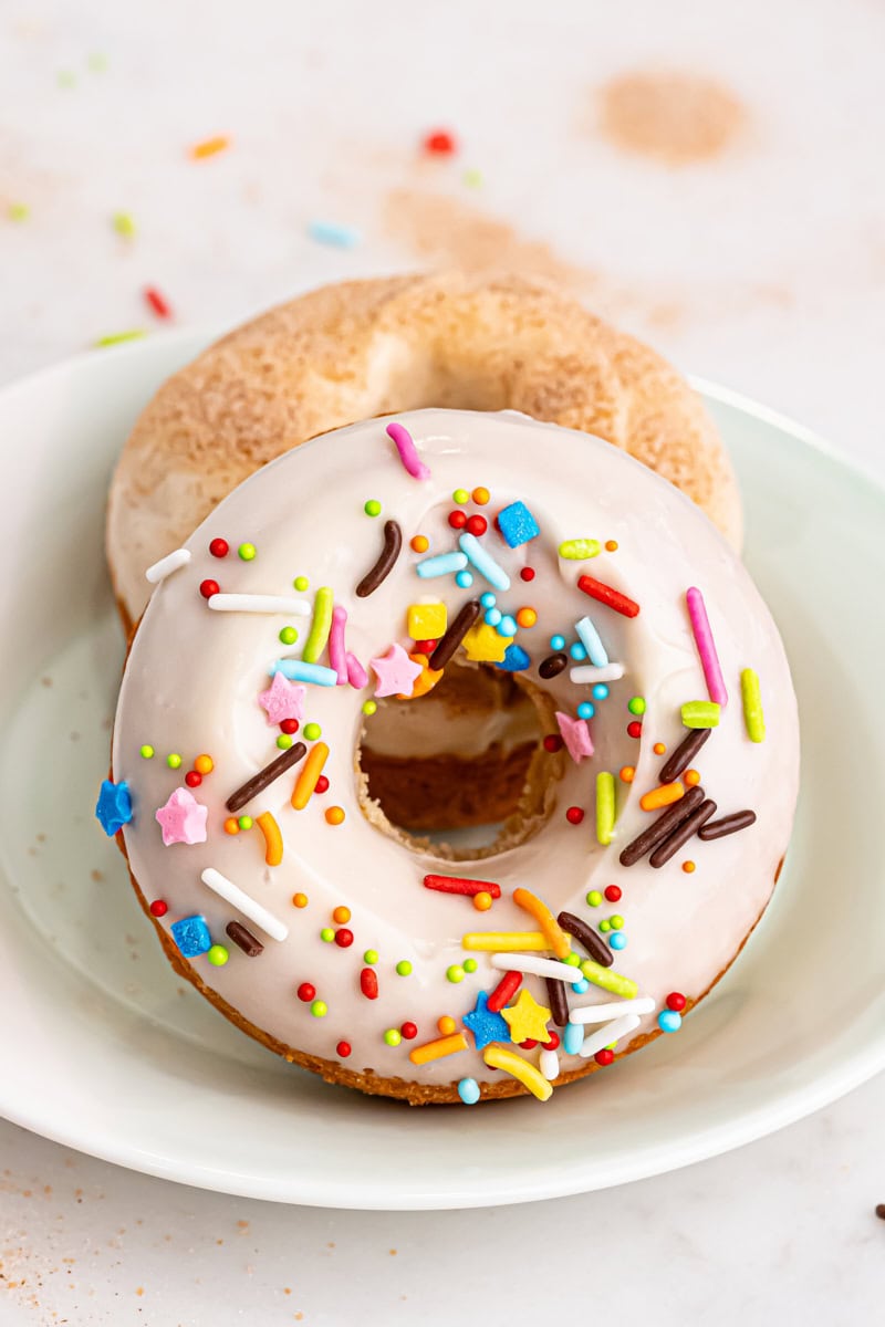 two baked doughnuts on a plate