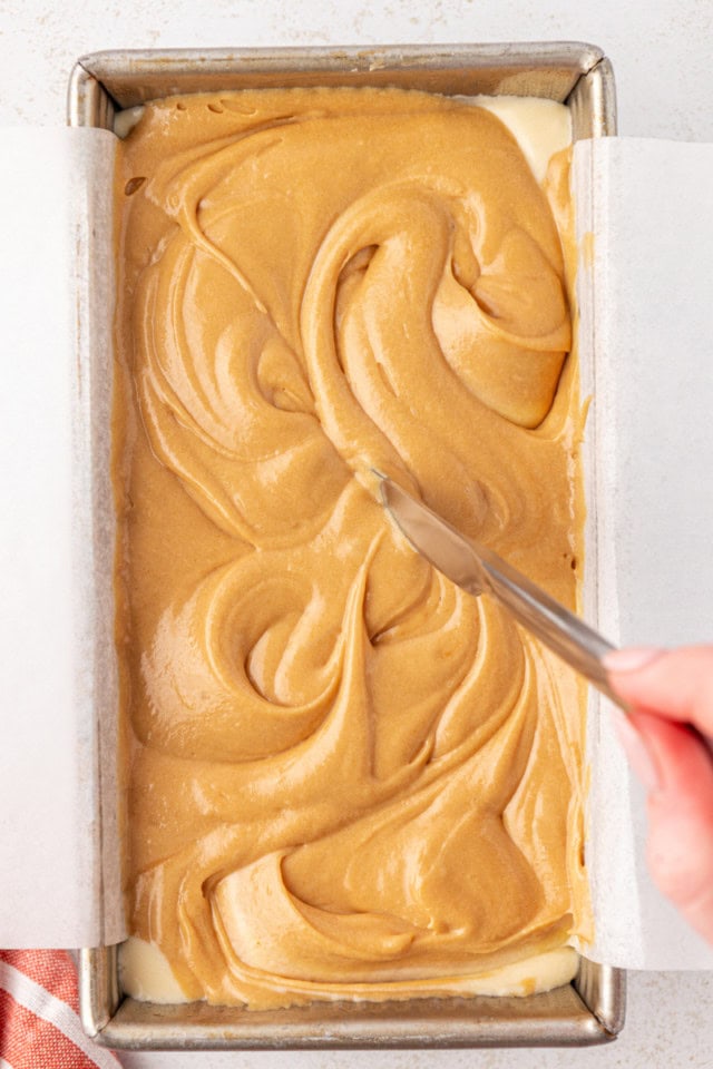 overhead view of swirling batters for marbled cookie butter cake