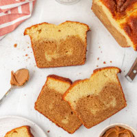 several slices of marbled cookie butter cake on a white countertop