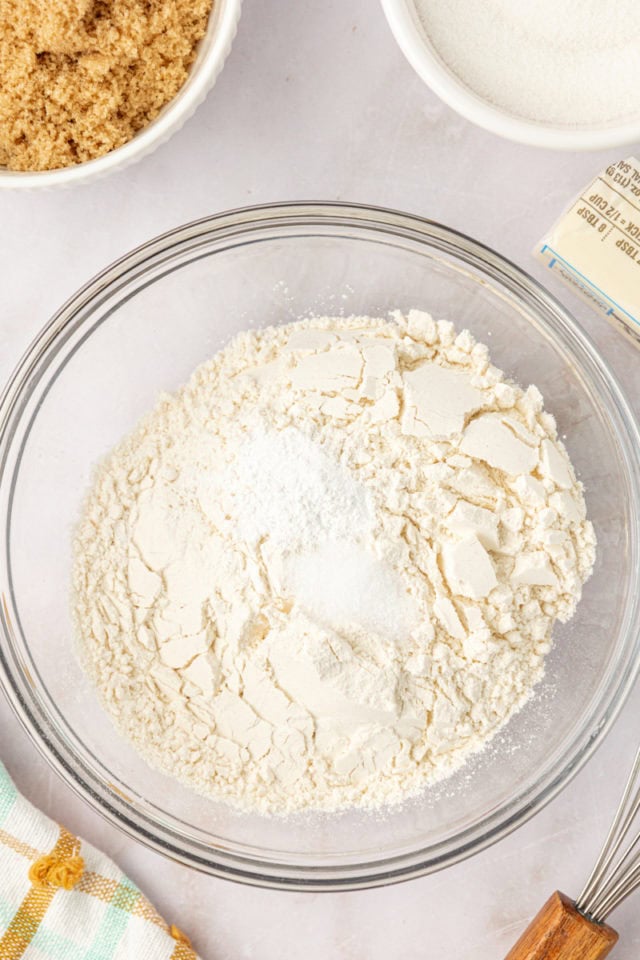 overhead view of flour, baking powder, and salt in a mixing bowl