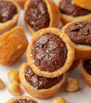 brownie tassies piled on a white plate