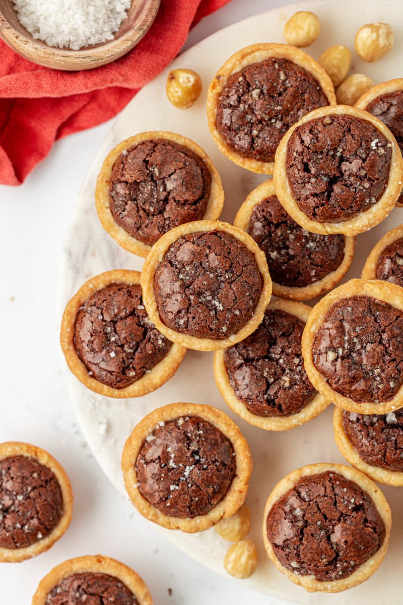 overhead view of brownie tassies on a marble serving plate