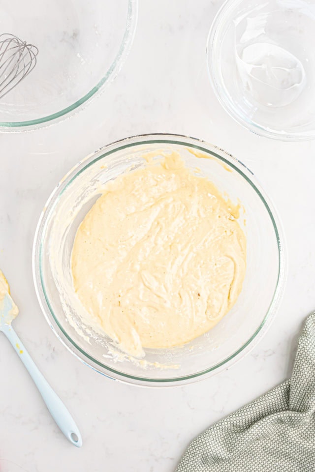 overhead view of tres leches cake batter in a mixing bowl