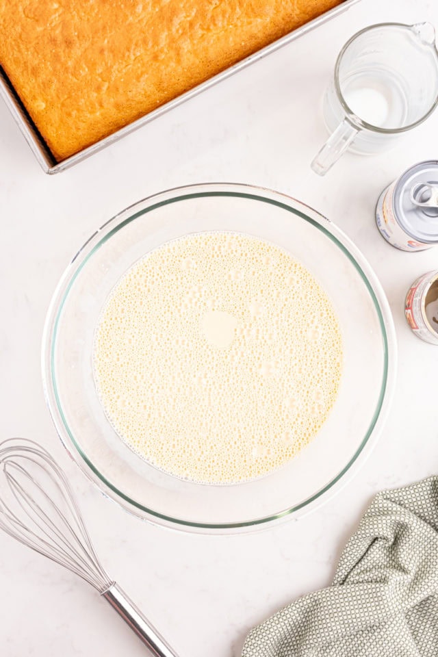 overhead view of three milk mixture for soaking tres leches cake