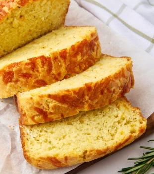 sliced herb and cheese quick bread on parchment paper