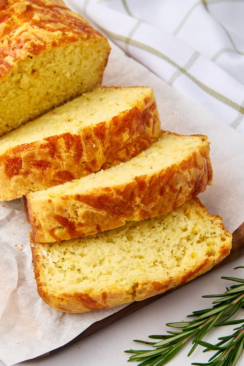 sliced herb and cheese quick bread on parchment paper