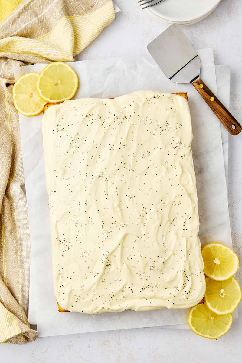 overhead view of frosted lemon poppy seed cake