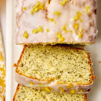 overhead view of partially sliced lemon poppy seed loaf