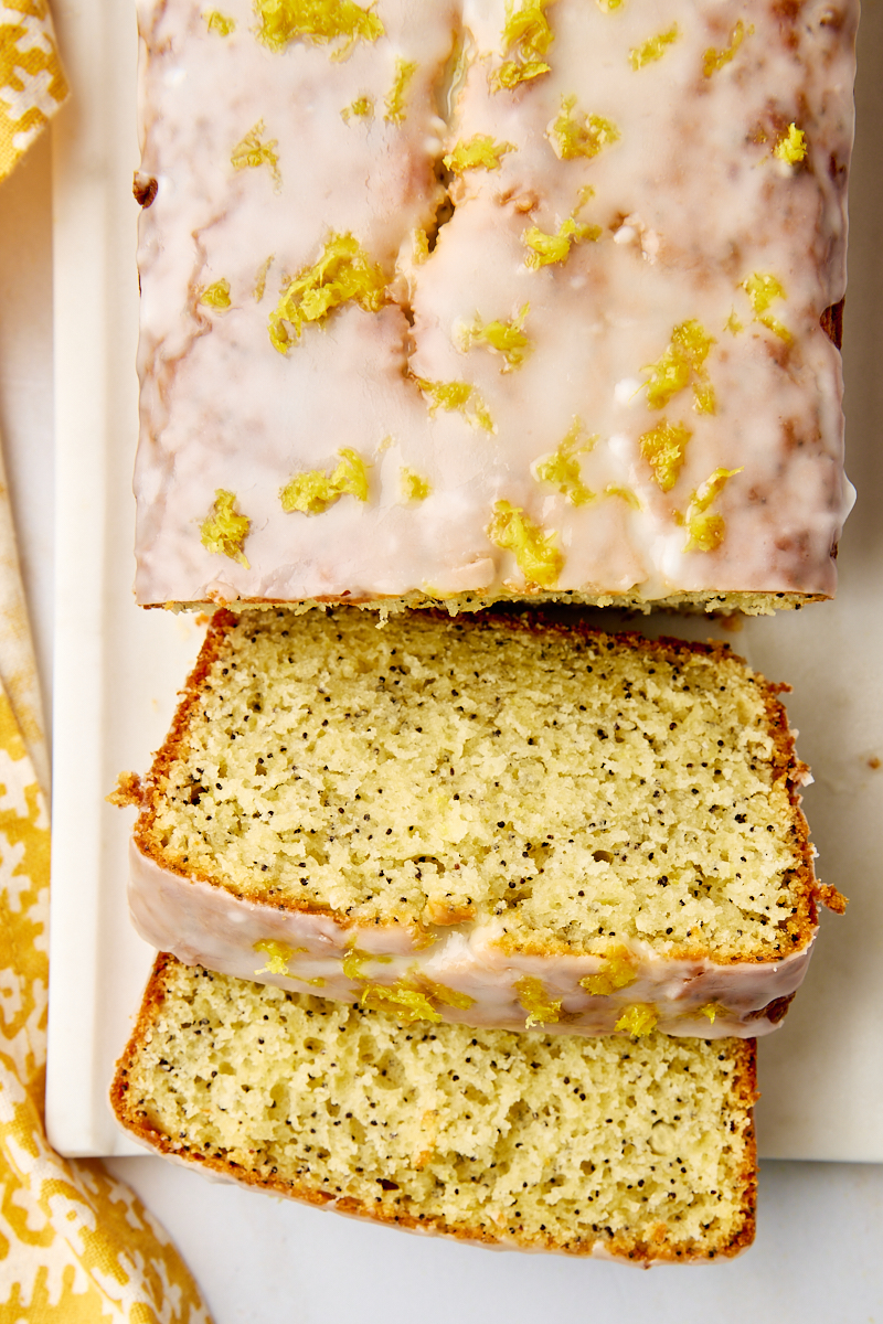 overhead view of partially sliced lemon poppy seed loaf