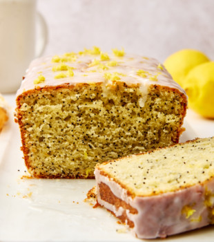 lemon poppy seed loaf cut to show the soft, seed-filled inside